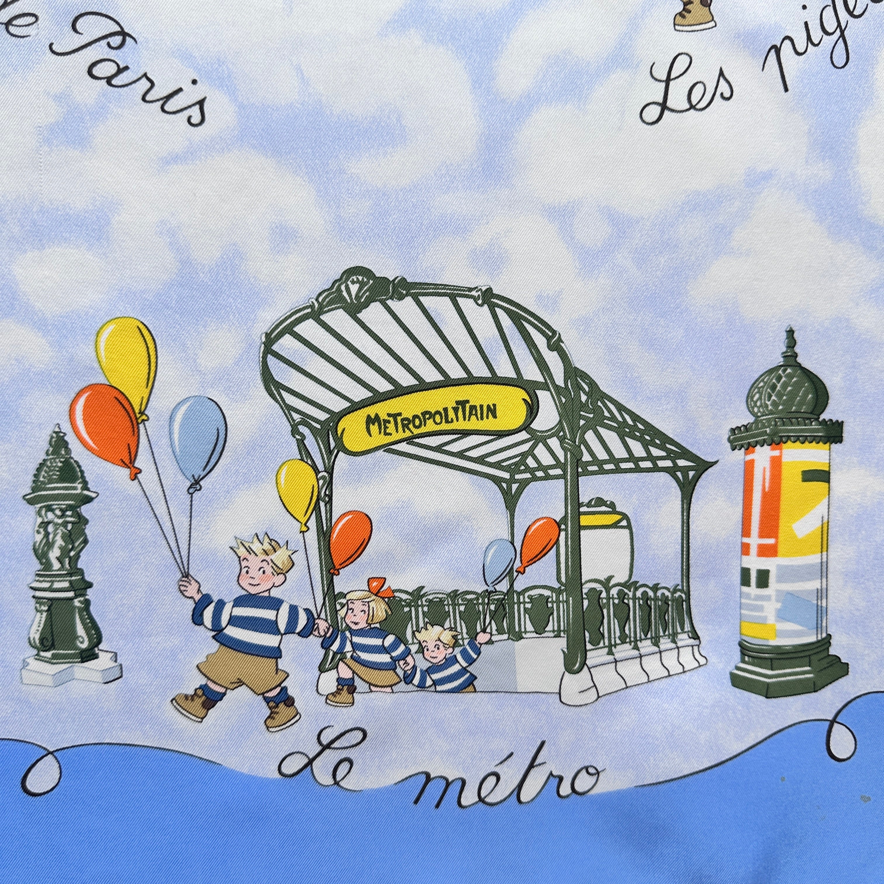 Scène humoristique des Triplés à une bouche de métro parisien Guimard.