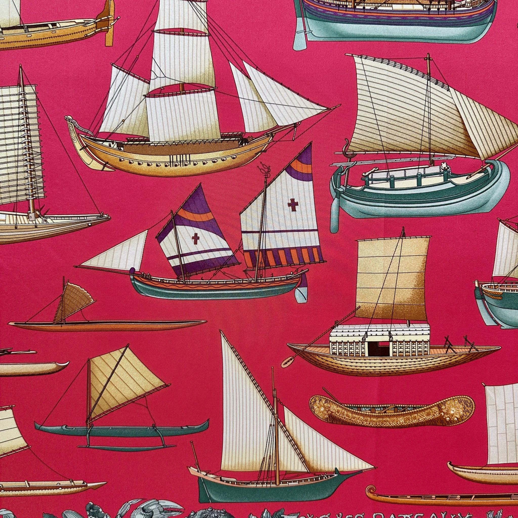 Vue de la partie centrale du foulard représentant des bateaux de différents pays sur un fond rose shocking